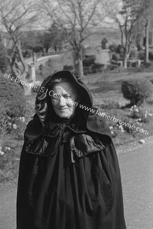 HOODED CLOAK ( MRS O'LEARY ) AT PAROCHIAL HOUSE